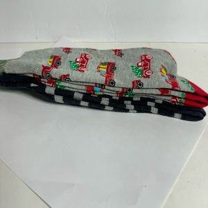 NWT. 3 pairs of socks. 2 PK MEN'S CREW SOCKS and one pair of Santa golf socks